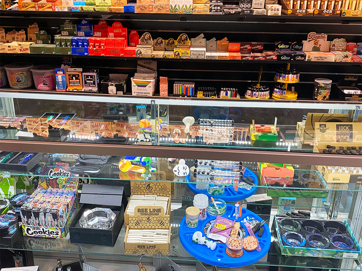 A product display of pipes, lighters, rolling papers, and other smoking accessory products at our Bloomfield head shop and tobacco store.