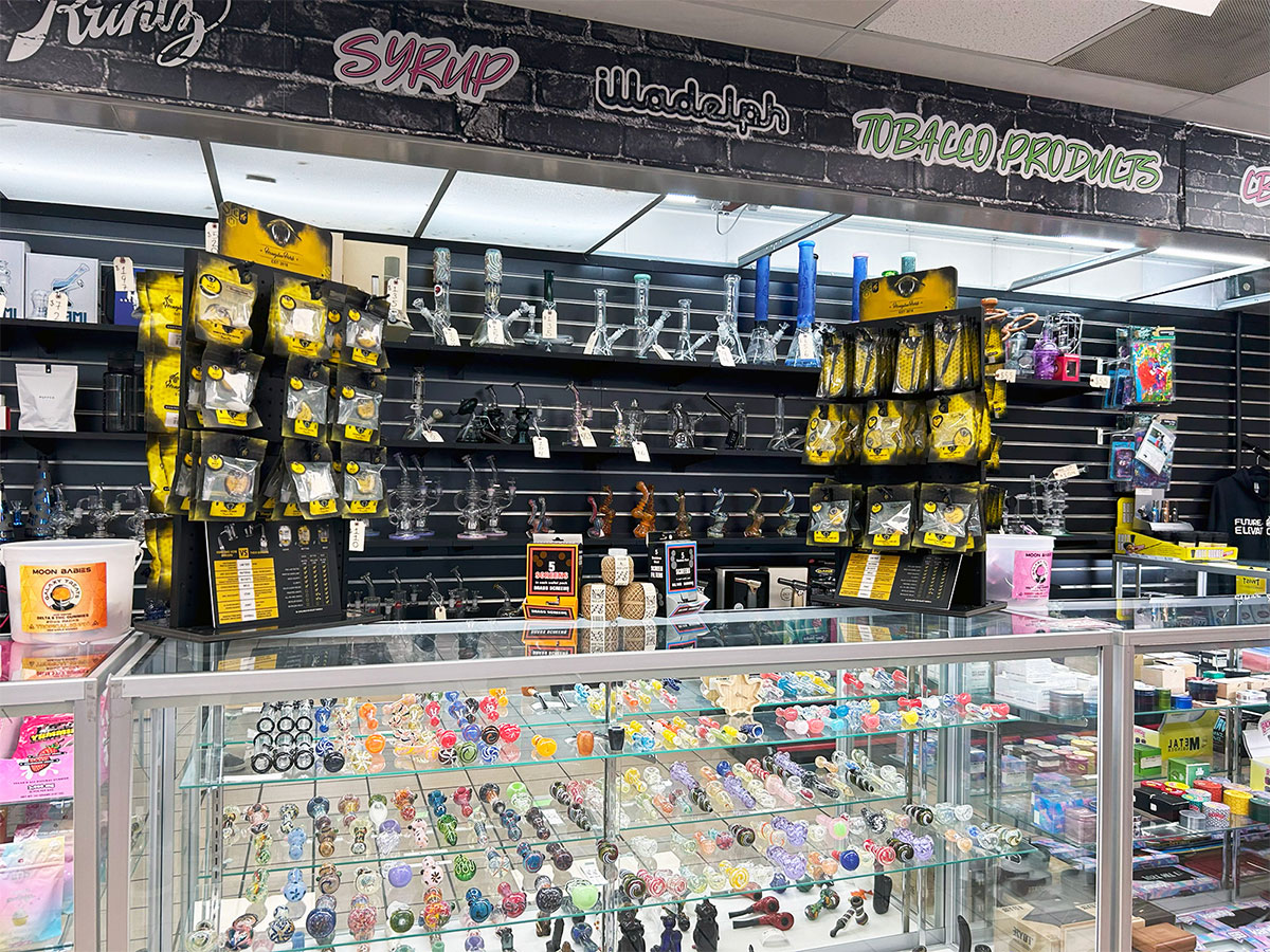A product display of pipes, bubblers, and other smoking accessory products at our Teaneck head shop and tobacco store.